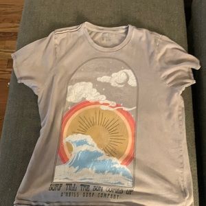 Gray Tilly’s shirt with design on the shirt sunset